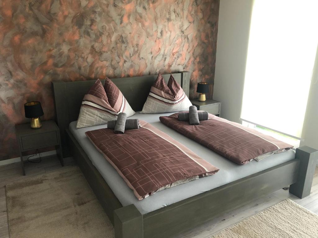 Postel nebo postele na pokoji v ubytování A-765 Apartman