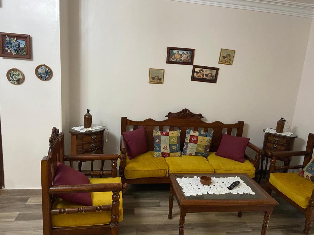 a living room with a couch and a table at nora's apartment in Cairo