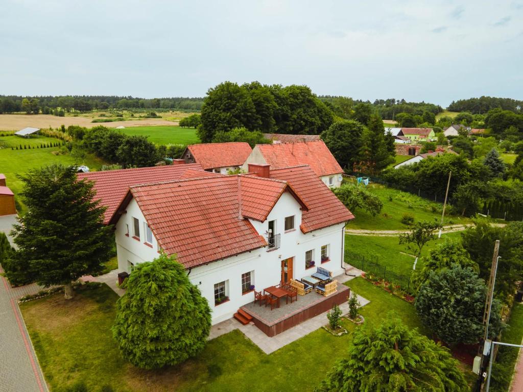 an aerial view of a white house with red roofs at Noclegi Orło na Mazurach in Ryn