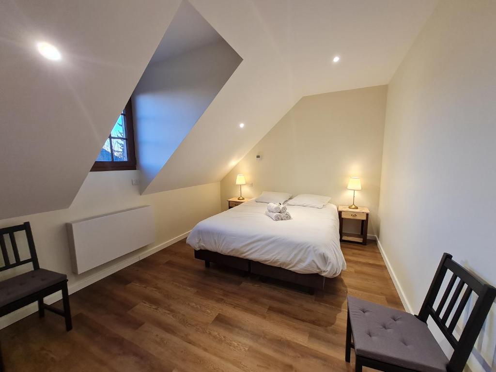Postel nebo postele na pokoji v ubytování Le Faubourg - Gîte et chambres d'hôte