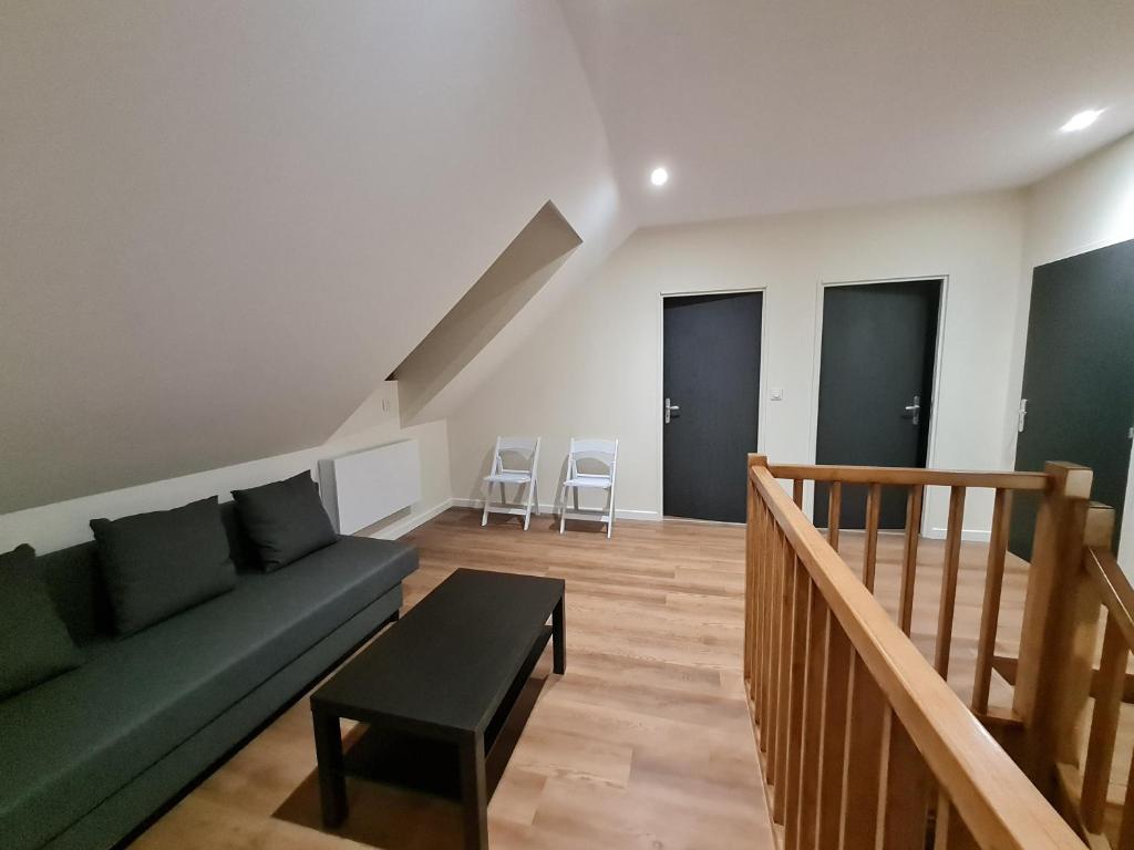 Posezení v ubytování Le Faubourg - Gîte et chambres d'hôte
