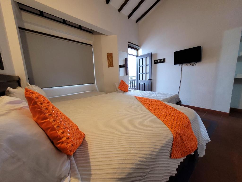 Postel nebo postele na pokoji v ubytování Hotel Cemandy by MA