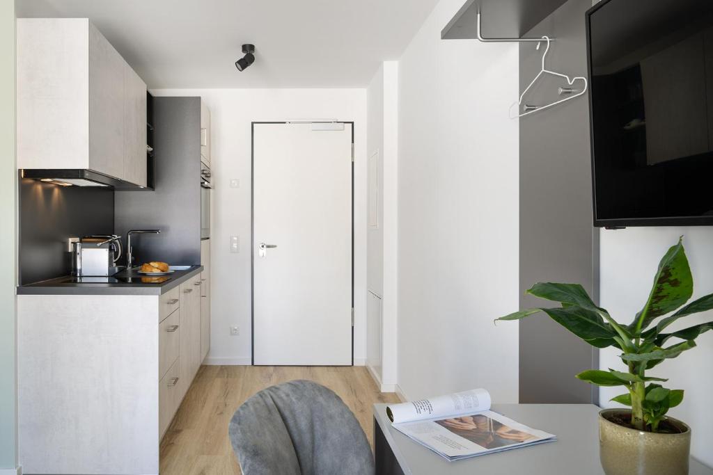 Kuchyň nebo kuchyňský kout v ubytování Snooze Apartments Alling