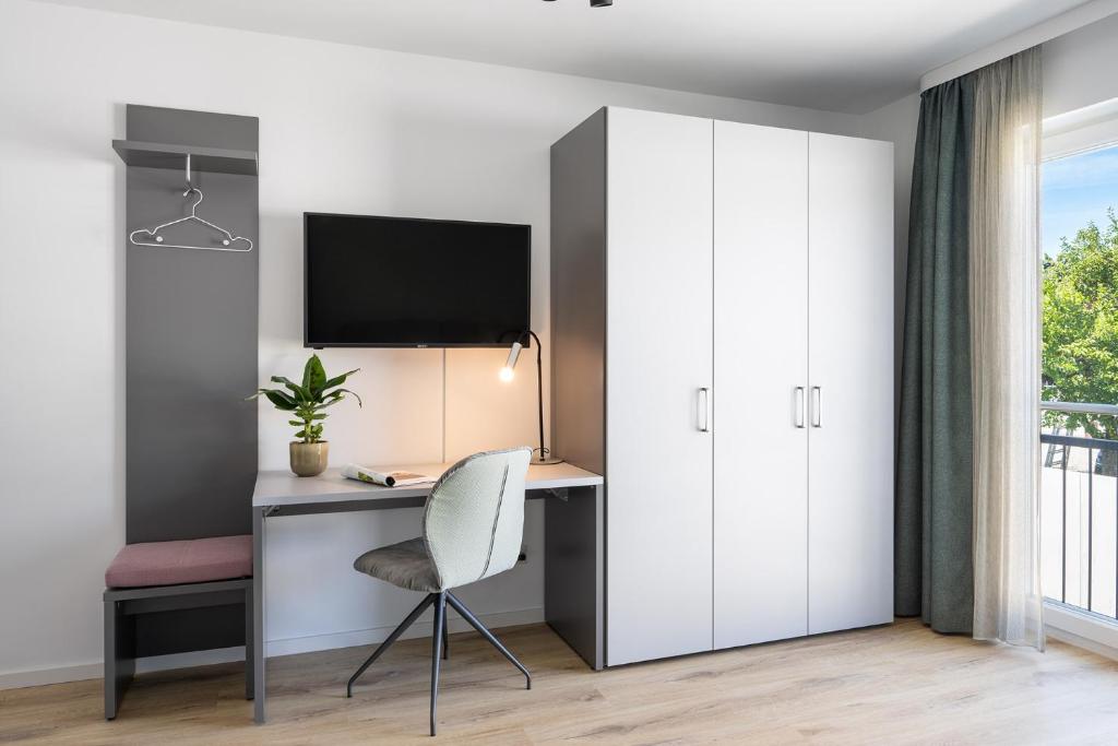 TV a/nebo společenská místnost v ubytování Snooze Apartments Alling