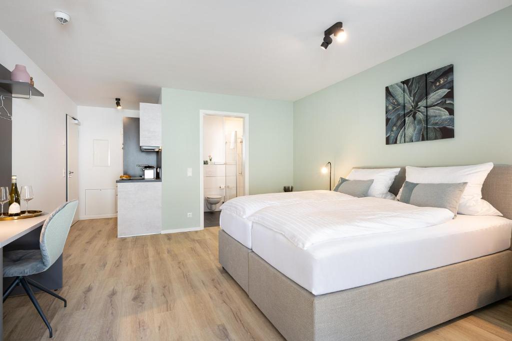 Postel nebo postele na pokoji v ubytování Snooze Apartments Alling