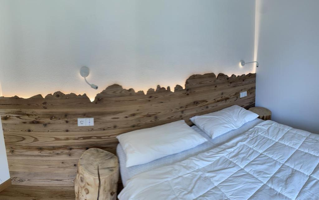 Cama o camas de una habitación en Appartamenti Campiglio