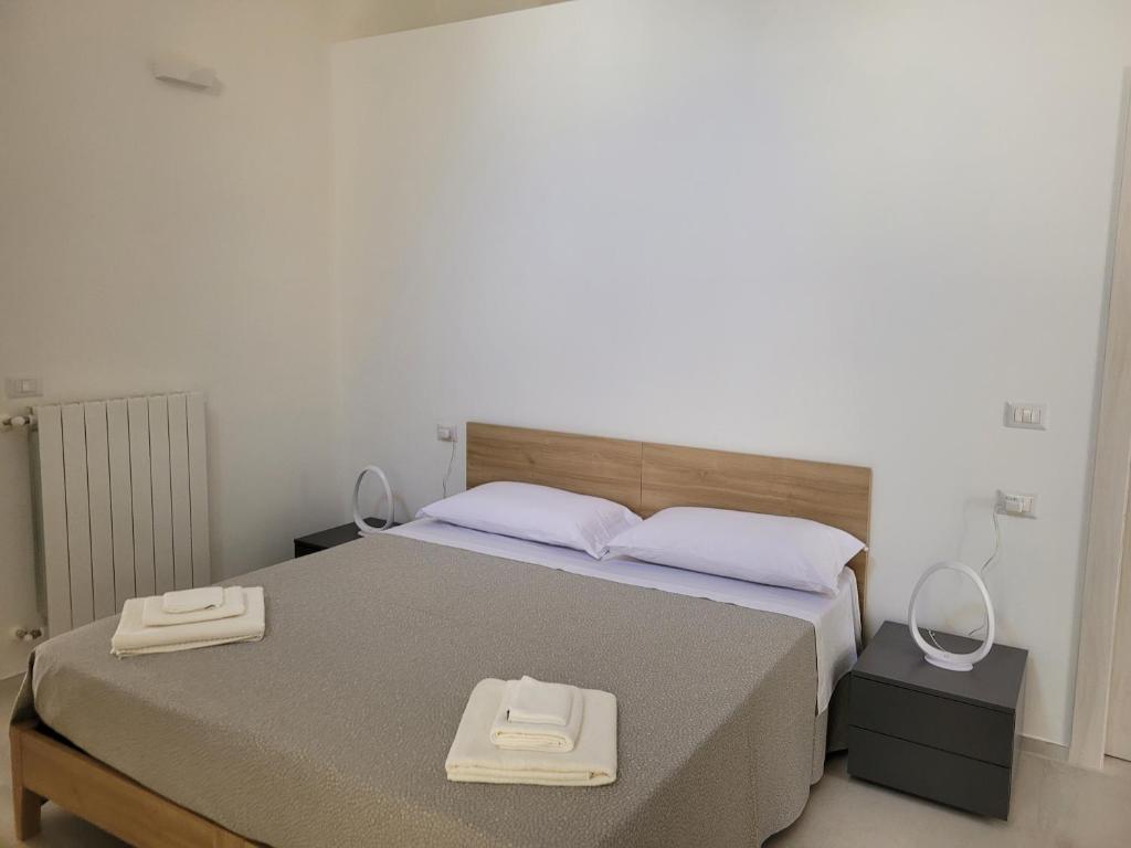 Postel nebo postele na pokoji v ubytování Le dimore del salento appartamento 1