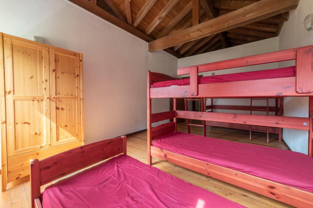 Postel nebo postele na pokoji v ubytování Rifugio Parpinasca