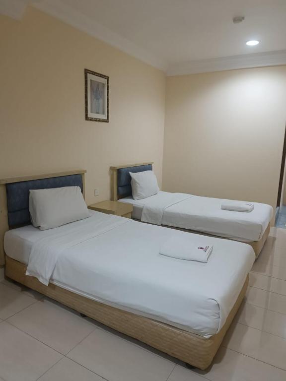 Postel nebo postele na pokoji v ubytování HOTEL AMBASSADOR 2