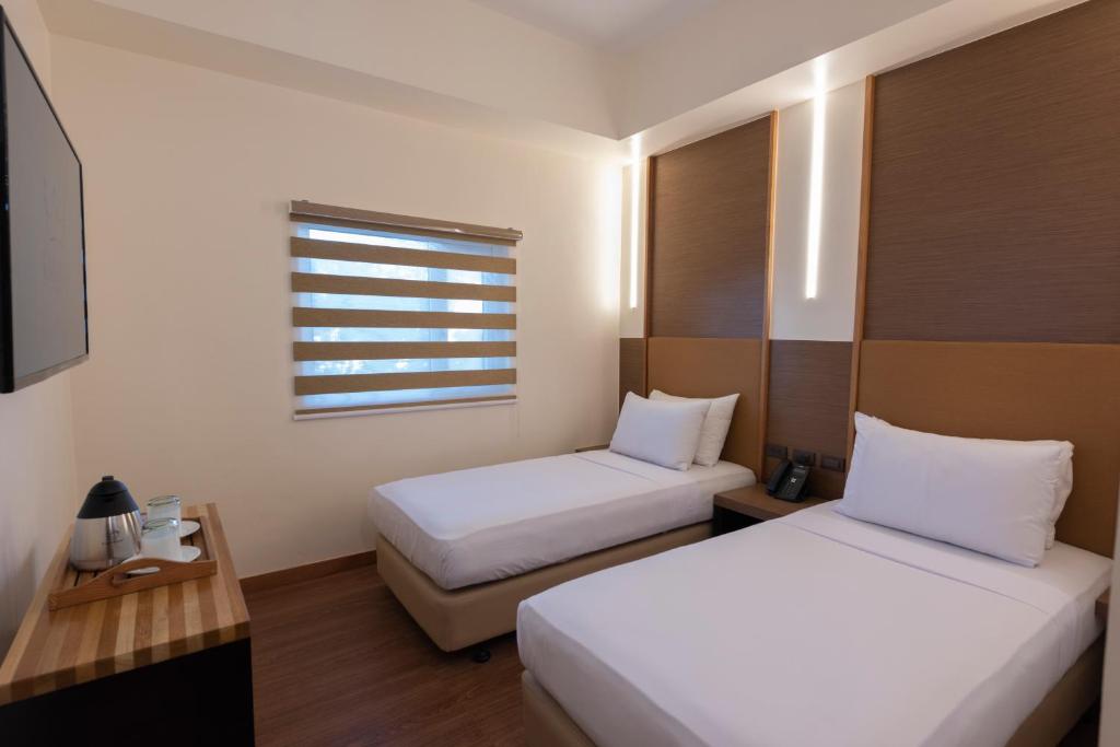 Kabayan Hotel Pasayにあるベッド