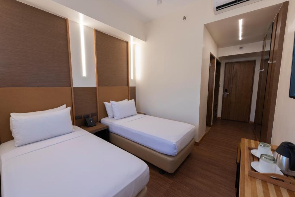 Kabayan Hotel Pasayにあるベッド