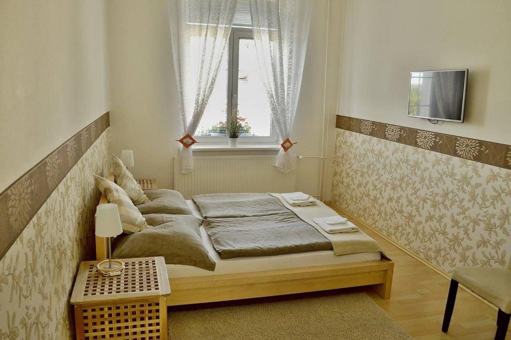 Postel nebo postele na pokoji v ubytování Hotel Florian
