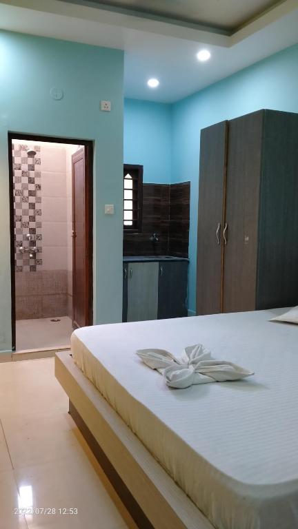 Postel nebo postele na pokoji v ubytování Ashirbad Guest House