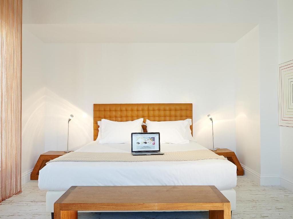 Posteľ alebo postele v izbe v ubytovaní Grecotel Pallas Athena