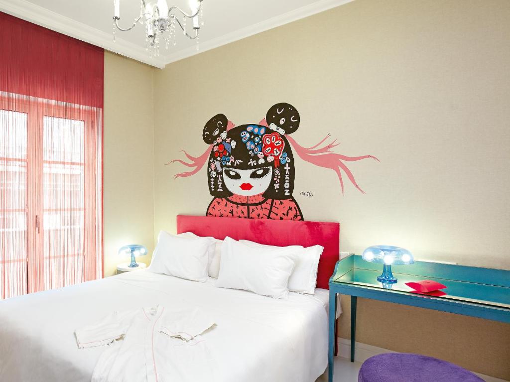 Posteľ alebo postele v izbe v ubytovaní Grecotel Pallas Athena
