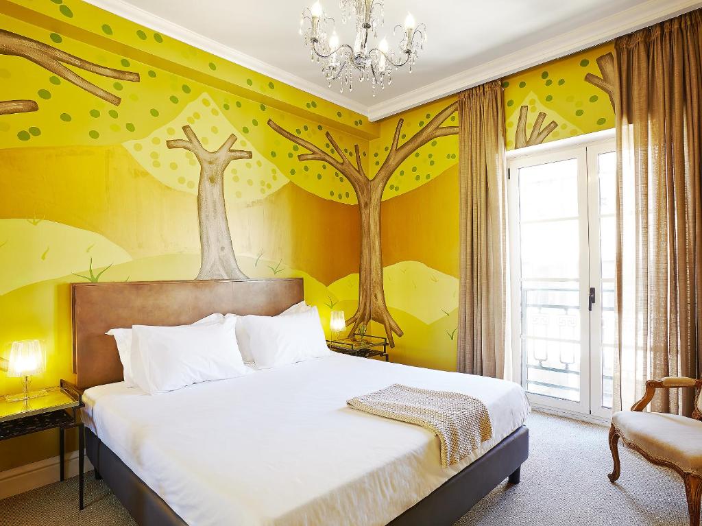 Posteľ alebo postele v izbe v ubytovaní Grecotel Pallas Athena
