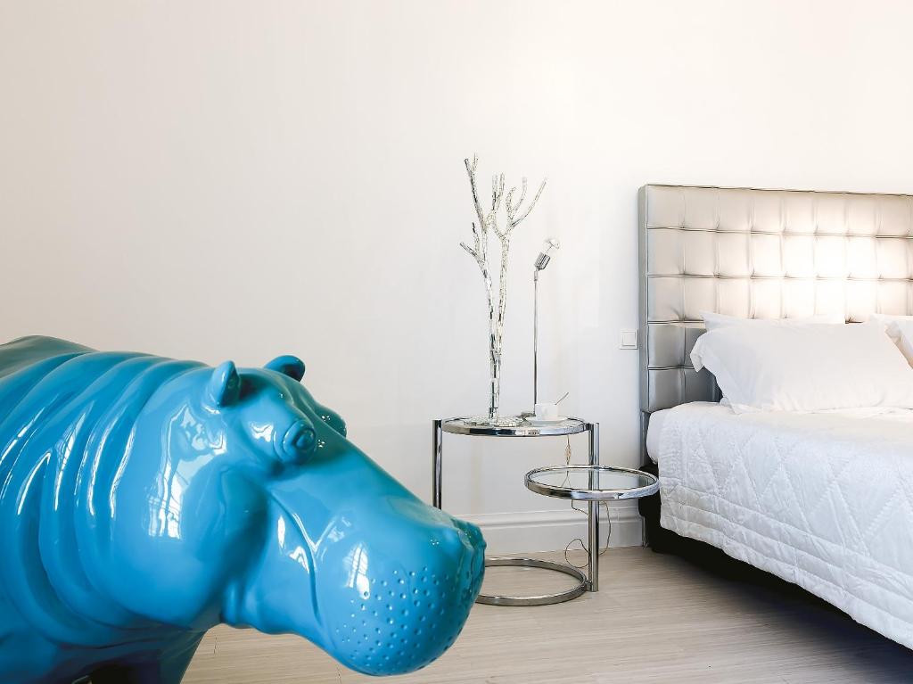 Posteľ alebo postele v izbe v ubytovaní Grecotel Pallas Athena
