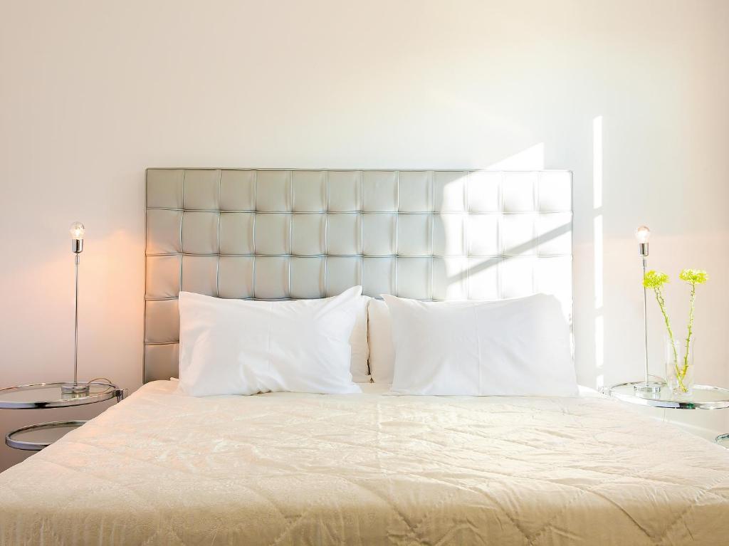 Posteľ alebo postele v izbe v ubytovaní Grecotel Pallas Athena