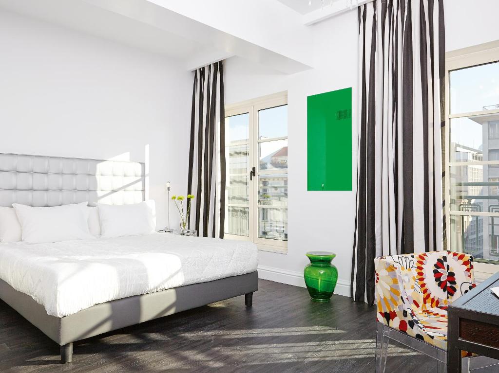 Posteľ alebo postele v izbe v ubytovaní Grecotel Pallas Athena