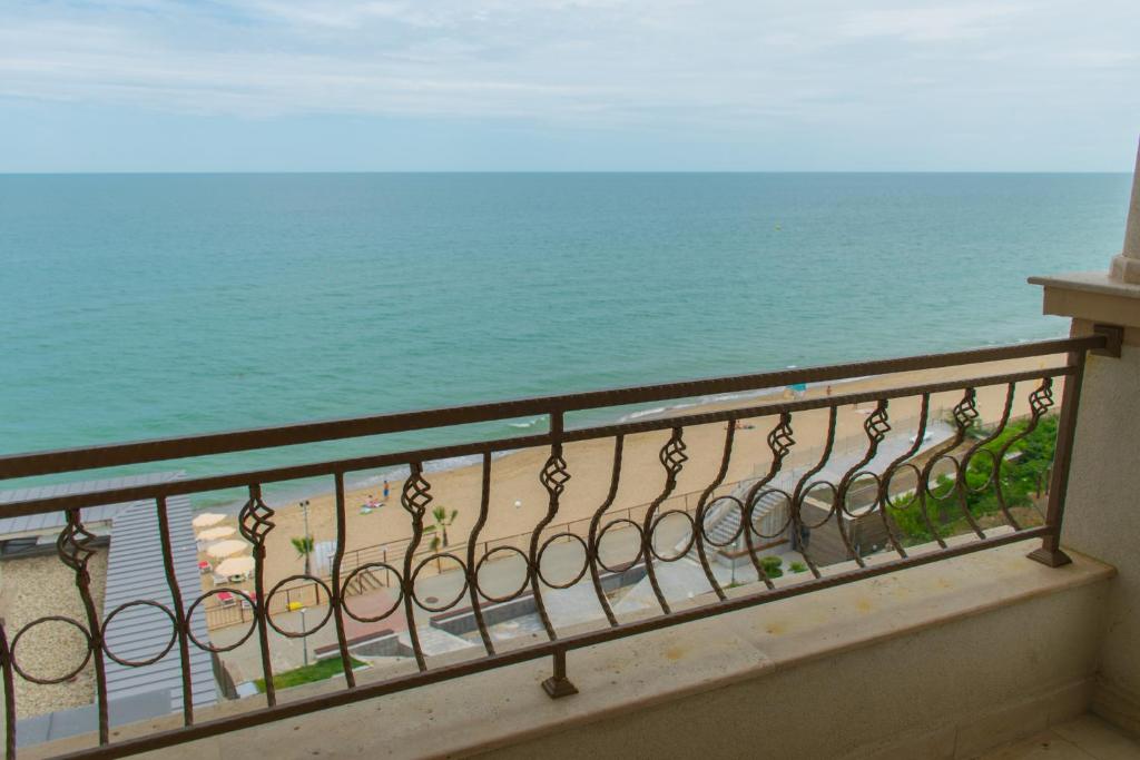 a balcony with a view of the ocean at Paraiso Theopolis - All Inclusive in Obzor
