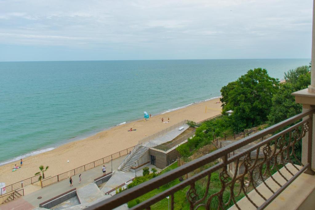 a view of a beach from a balcony at Paraiso Theopolis - All Inclusive in Obzor