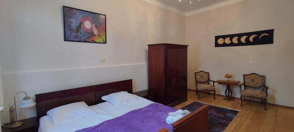 Postel nebo postele na pokoji v ubytování Tuta House Sighnaghi