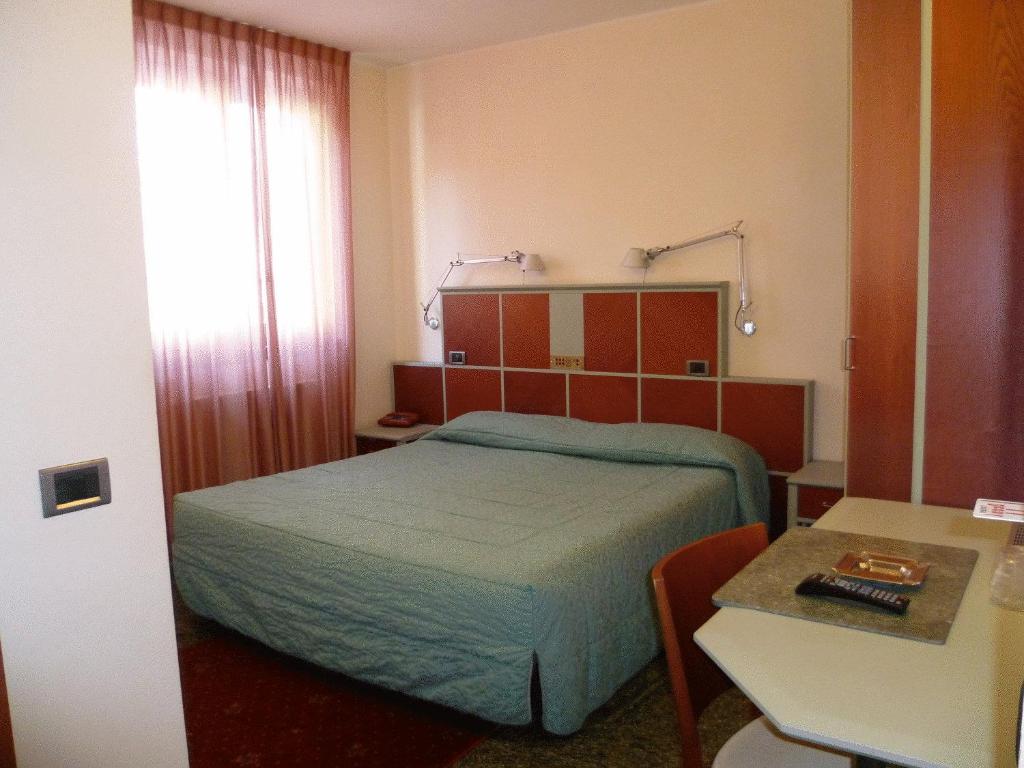 Postel nebo postele na pokoji v ubytování Hotel Derby
