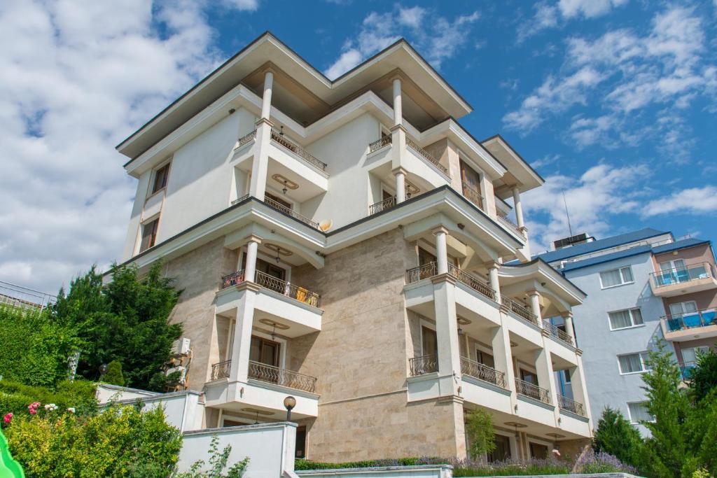 a building with balconies on the side of it at Paraiso Theopolis - All Inclusive in Obzor