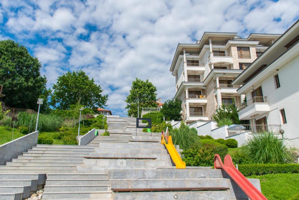 a set of stairs in front of a building at Paraiso Theopolis - All Inclusive in Obzor