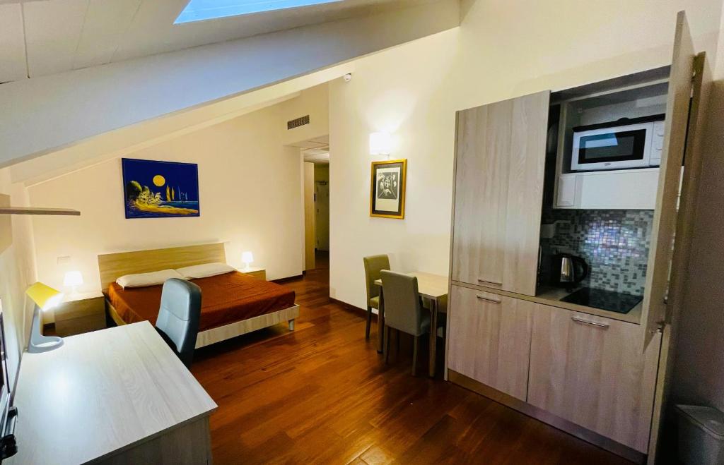 A bed or beds in a room at Ego' Residence Ferrara