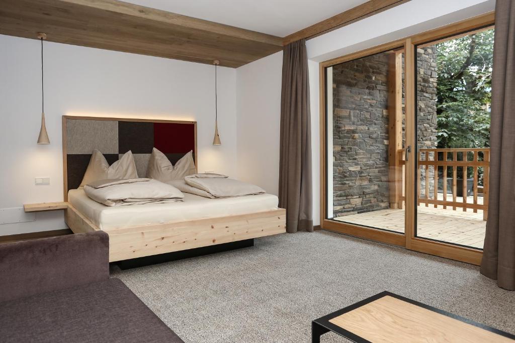 Postel nebo postele na pokoji v ubytování Hotel Gasthof Höllriegl