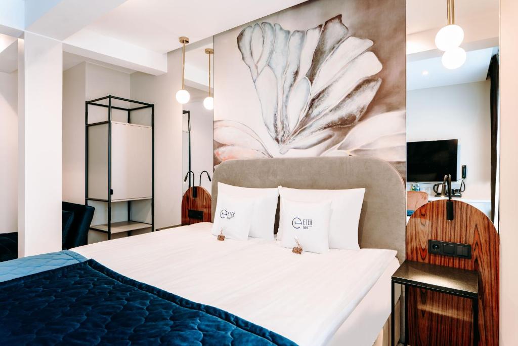 Postel nebo postele na pokoji v ubytování Hotel ETER