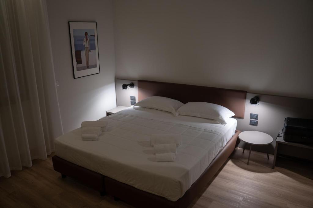 Postel nebo postele na pokoji v ubytování Hotel Orientale