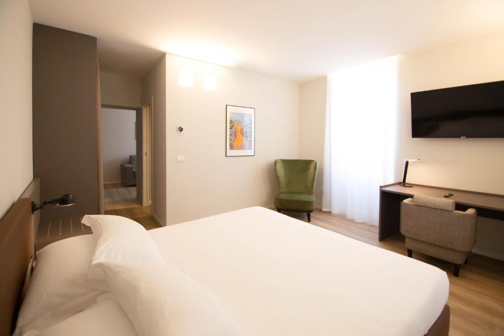 Postel nebo postele na pokoji v ubytování Hotel Orientale