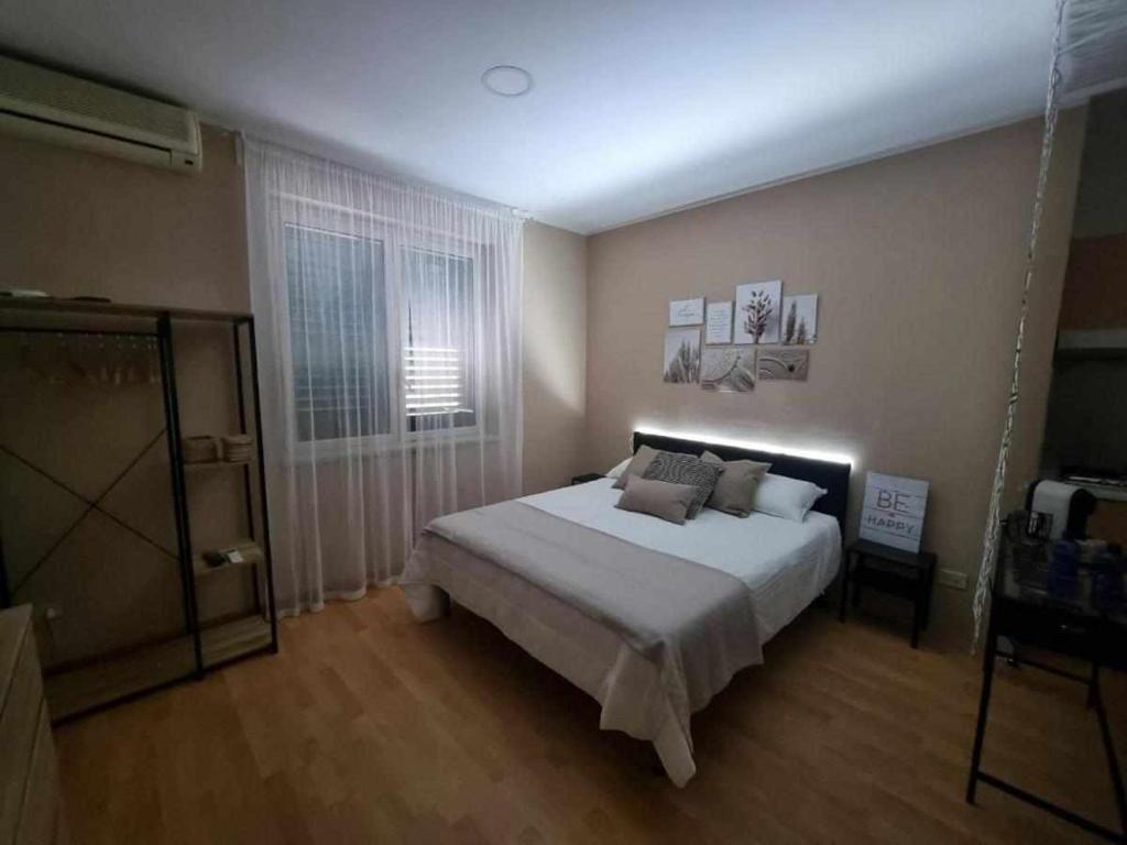 Posteľ alebo postele v izbe v ubytovaní Laura Home