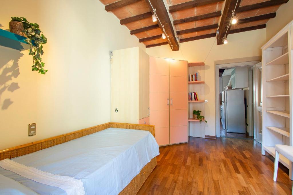 Posteľ alebo postele v izbe v ubytovaní APPARTAMENTO SULLA SALA