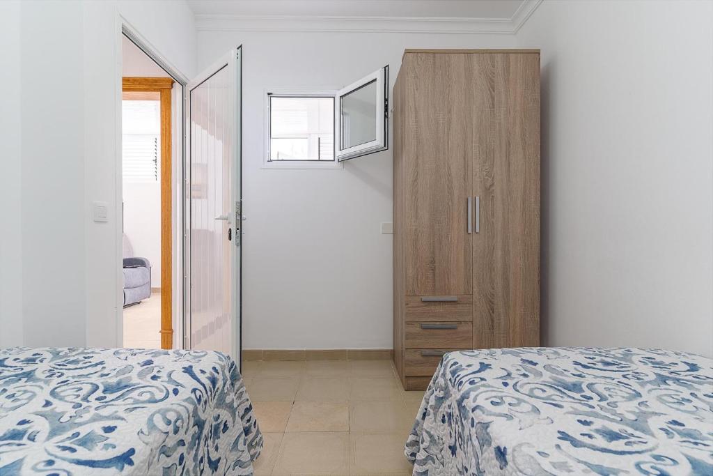 A bed or beds in a room at Apartamento Sussa 7A by HH
