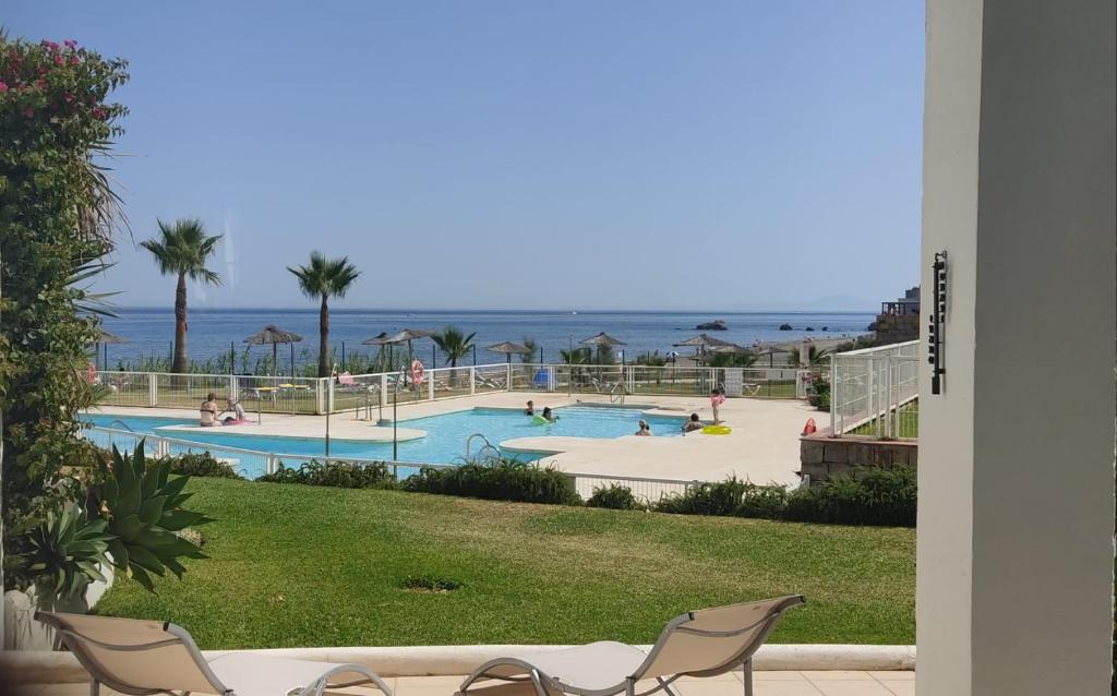 a view of a swimming pool at a resort at My Space on the Beach, Luxury Apartment in Casares