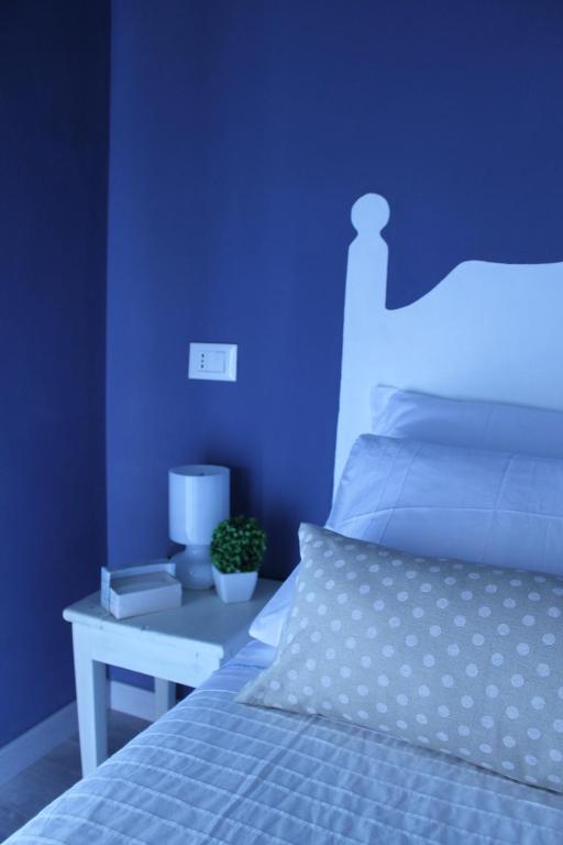 Posteľ alebo postele v izbe v ubytovaní B&B Nannalia