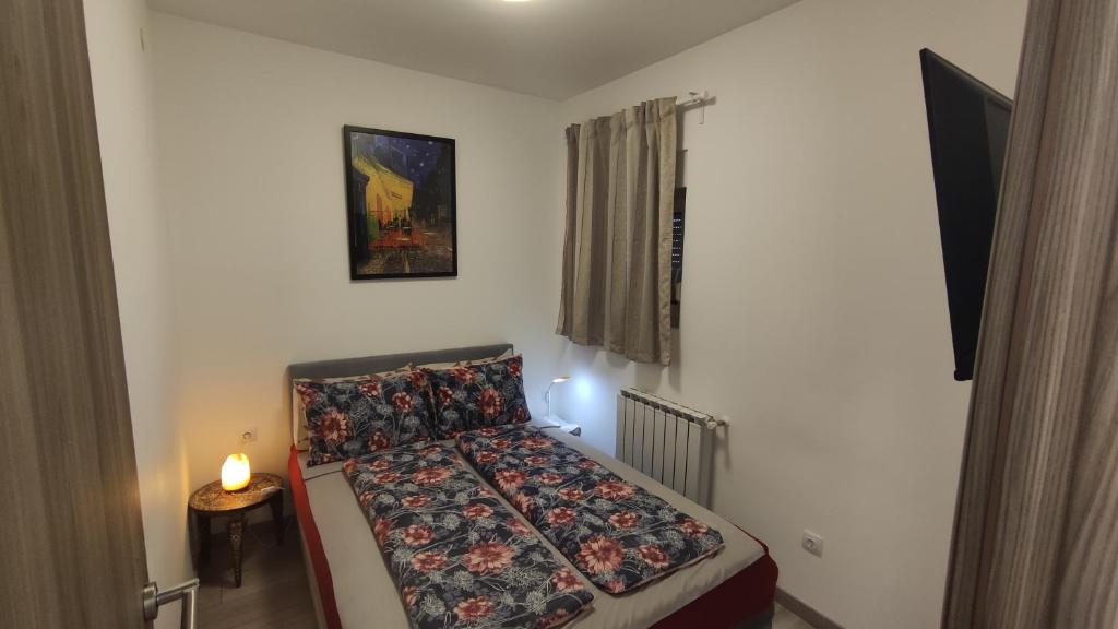 Posteľ alebo postele v izbe v ubytovaní APARTMENT NEVERA