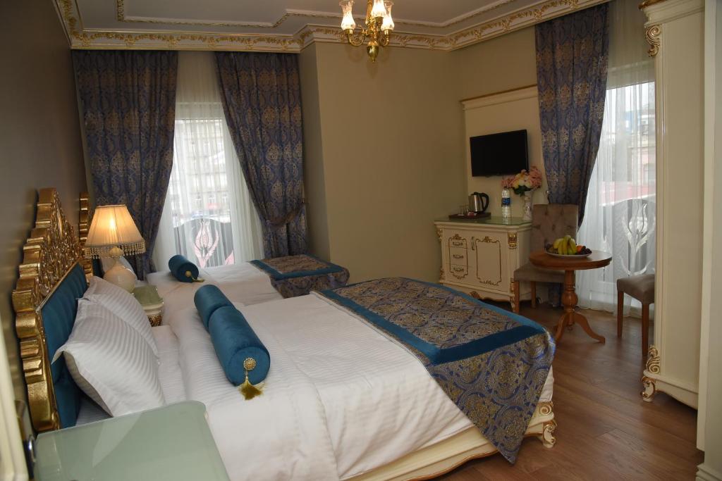 Postel nebo postele na pokoji v ubytování İstasyon Hotel