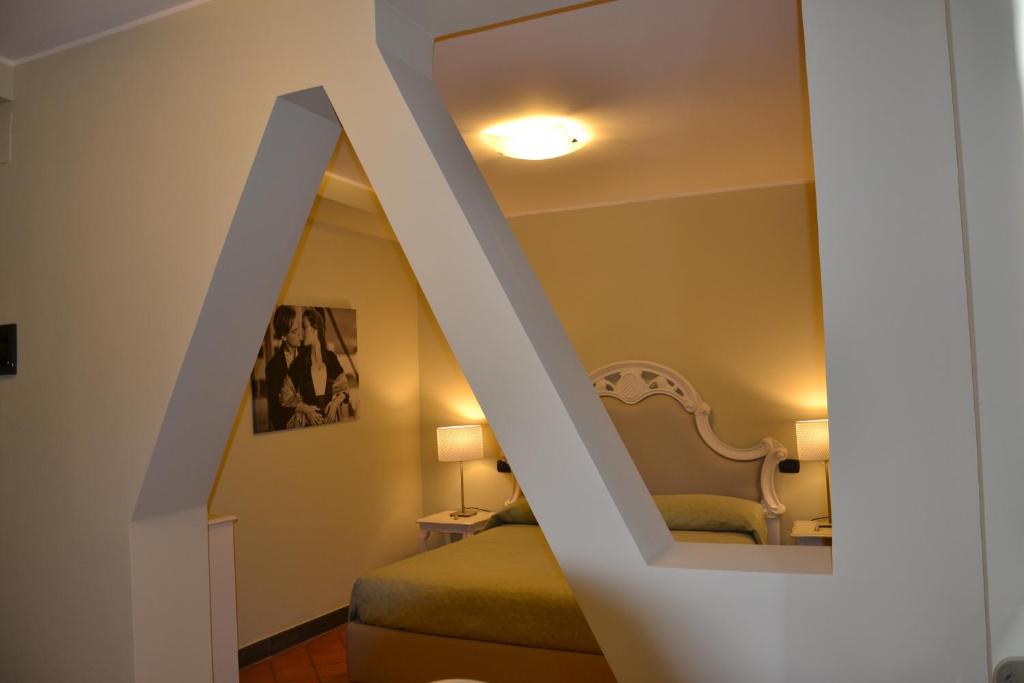 מיטה או מיטות בחדר ב-Art & Jazz Hotel
