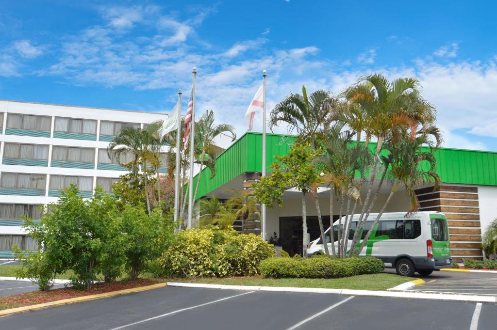 a white van parked in front of a building at Holiday Inn St. Petersburg N - Clearwater by IHG in Clearwater