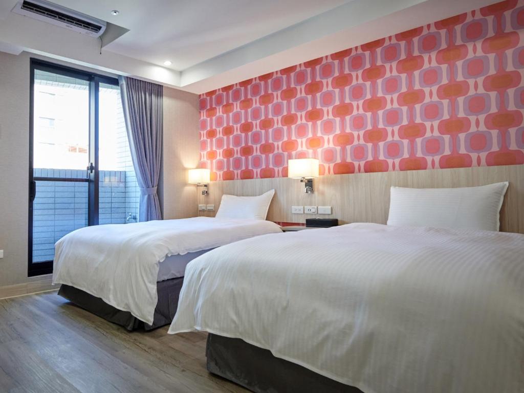 Postel nebo postele na pokoji v ubytování Comma Boutique Hotel