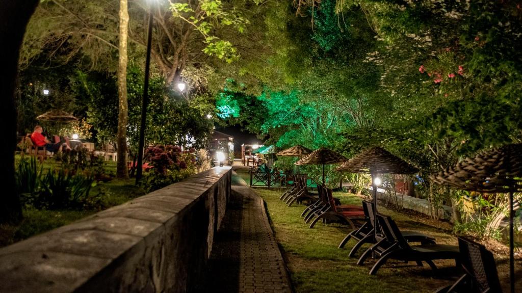 a row of chairs in a park at night at Fener Motel in Şile