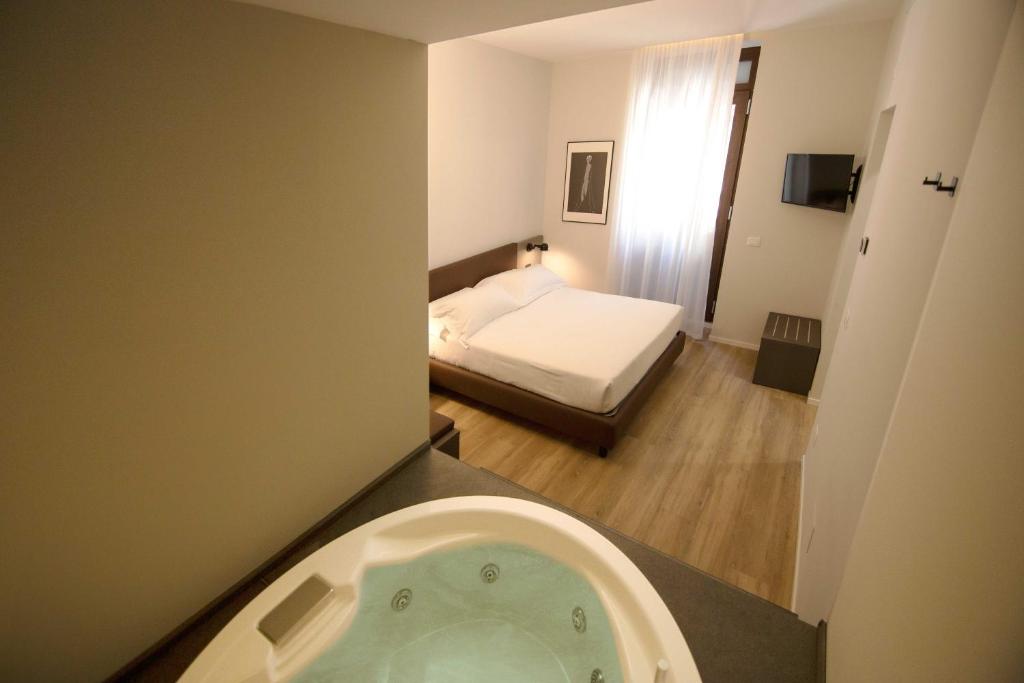 Postel nebo postele na pokoji v ubytování Hotel Orientale