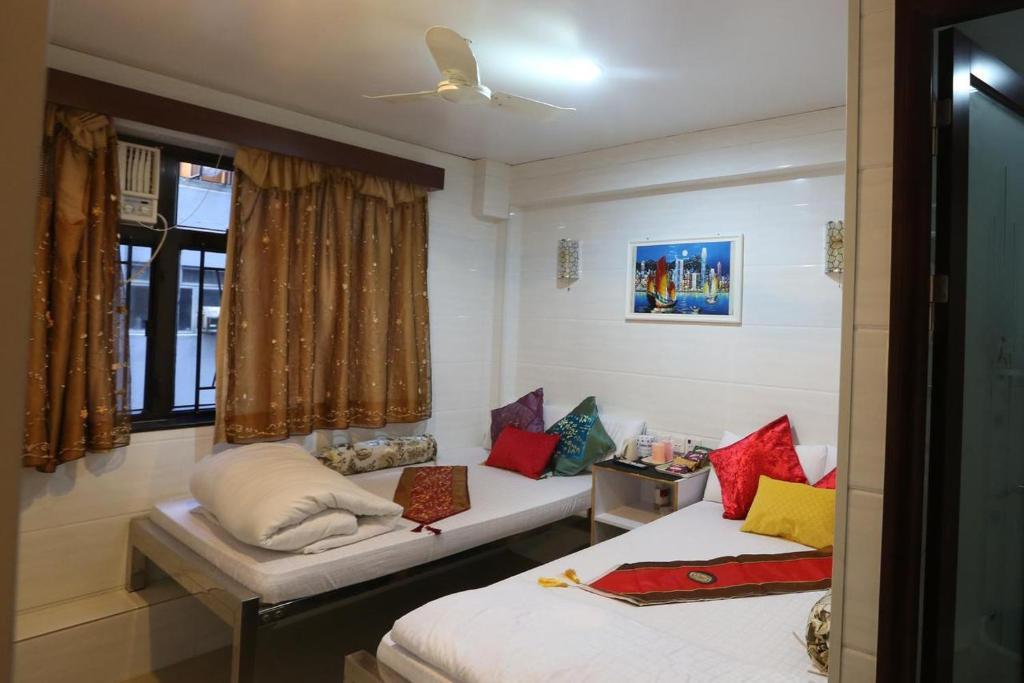 Postelja oz. postelje v sobi nastanitve Om Guest House