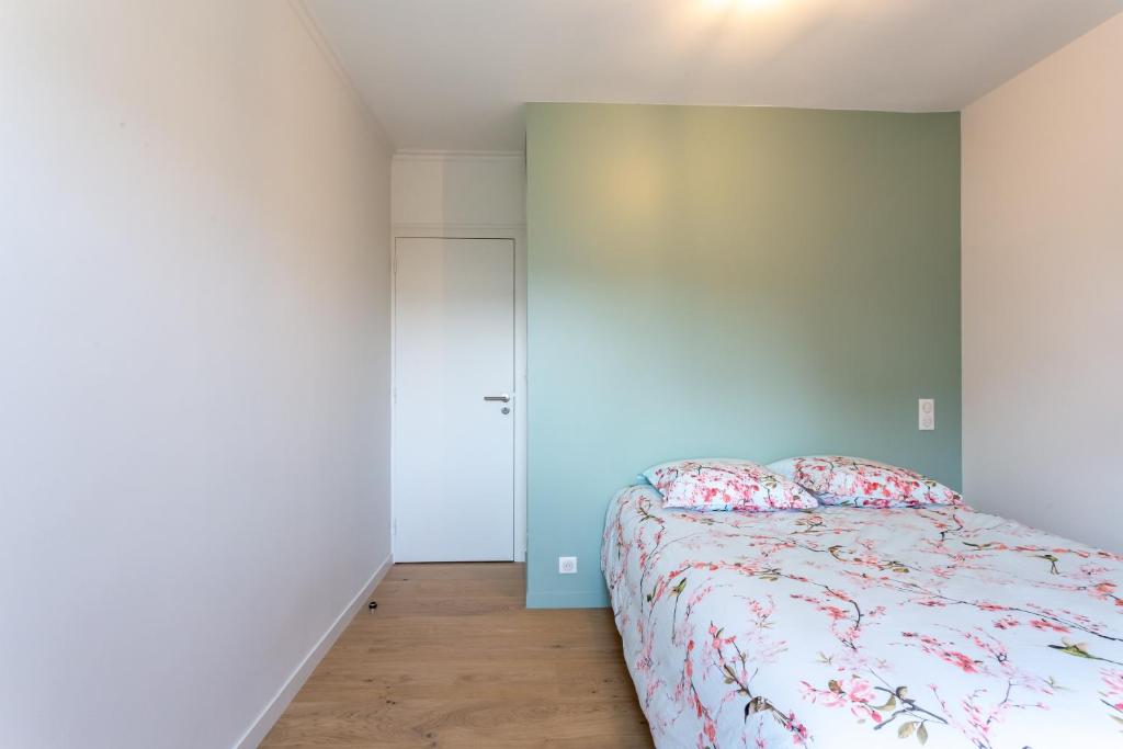Cama ou camas em um quarto em Le Refuge Marin - Gîte familial au bord de mer