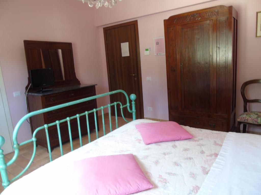 Posteľ alebo postele v izbe v ubytovaní Agriturismo Camera Rosa