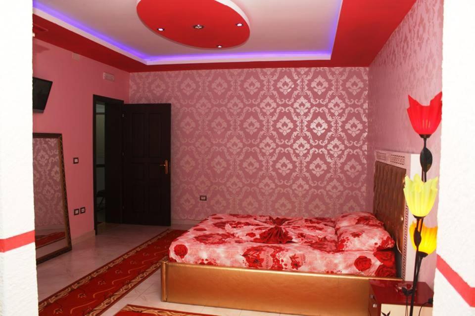 Postel nebo postele na pokoji v ubytování Hotel Buza